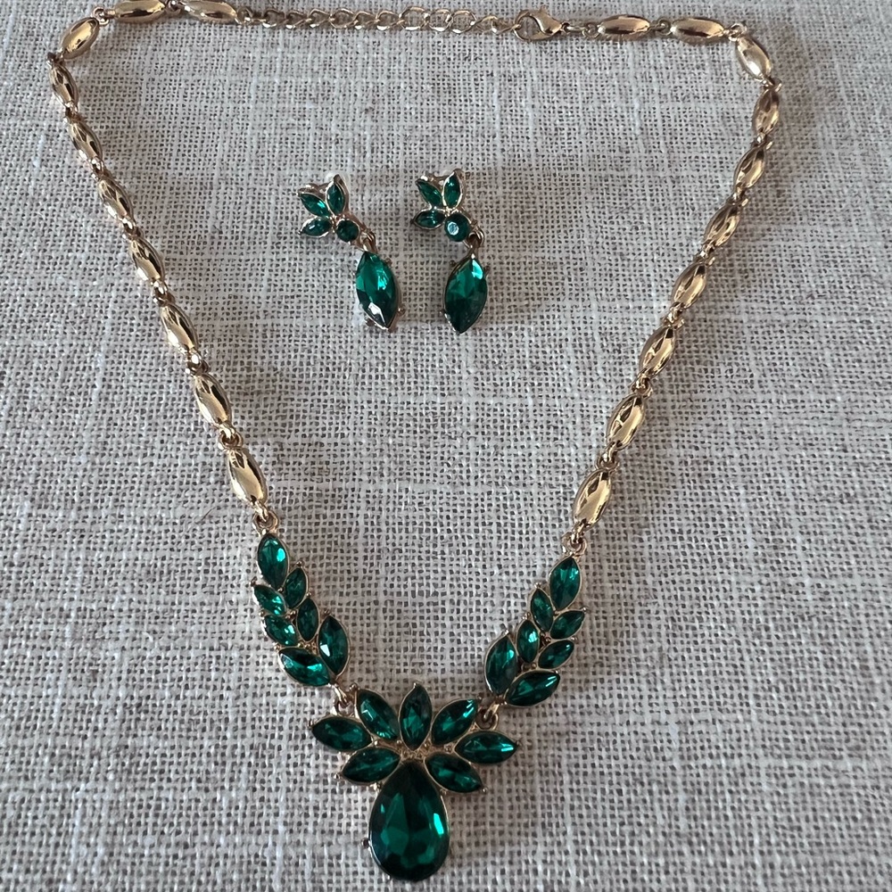 Gold necklace and earring costume jewelry set.